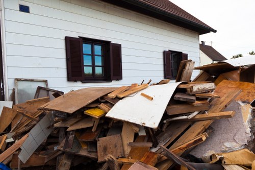 Bulk waste pickup truck removing furniture from home