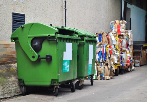 Workers using protective equipment during waste clearance